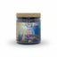 Candle jar labeled 'Cosmic Creator' with a cork lid on a white background