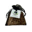 Virginia Cedar scented sachet with a black ribbon on a light surface